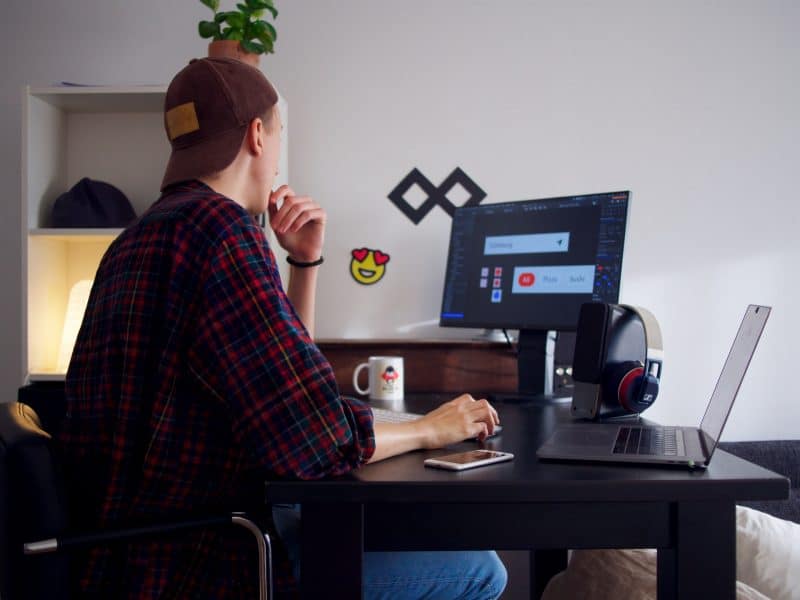 Man sitting at his desk using his computer
